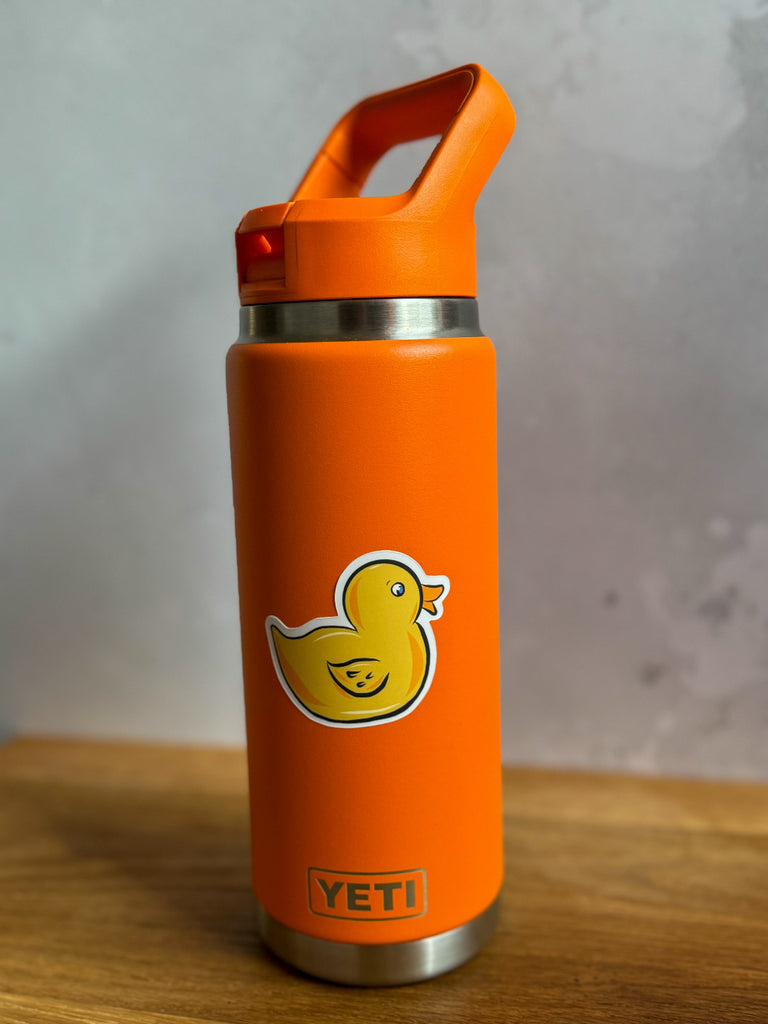 Yellow rubber duck vinyl sticker on a water bottle, adding a playful touch to everyday essentials